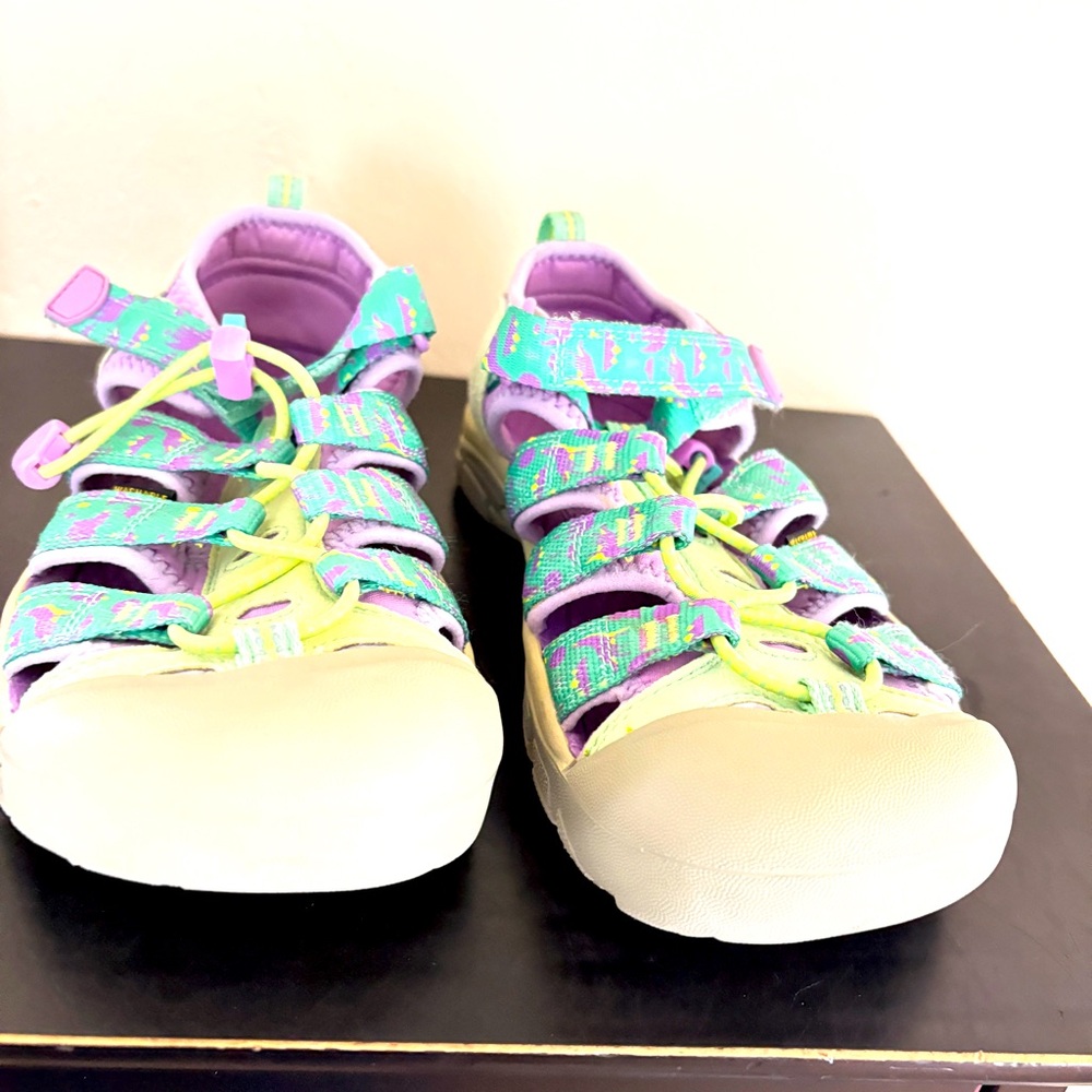 Keen, shoes/sandals.  Like sneakers. Quality. Velcro closure. Adj. US size 4.